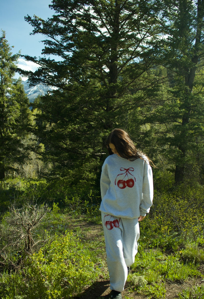 A gray cherry bow crewneck